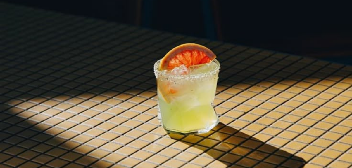 Which Is More Profitable for Local Alcohol Producers: Competing with International Brands or Collaborating?